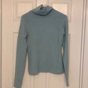 Light blue double yarn cashmere turtleneck sweater.